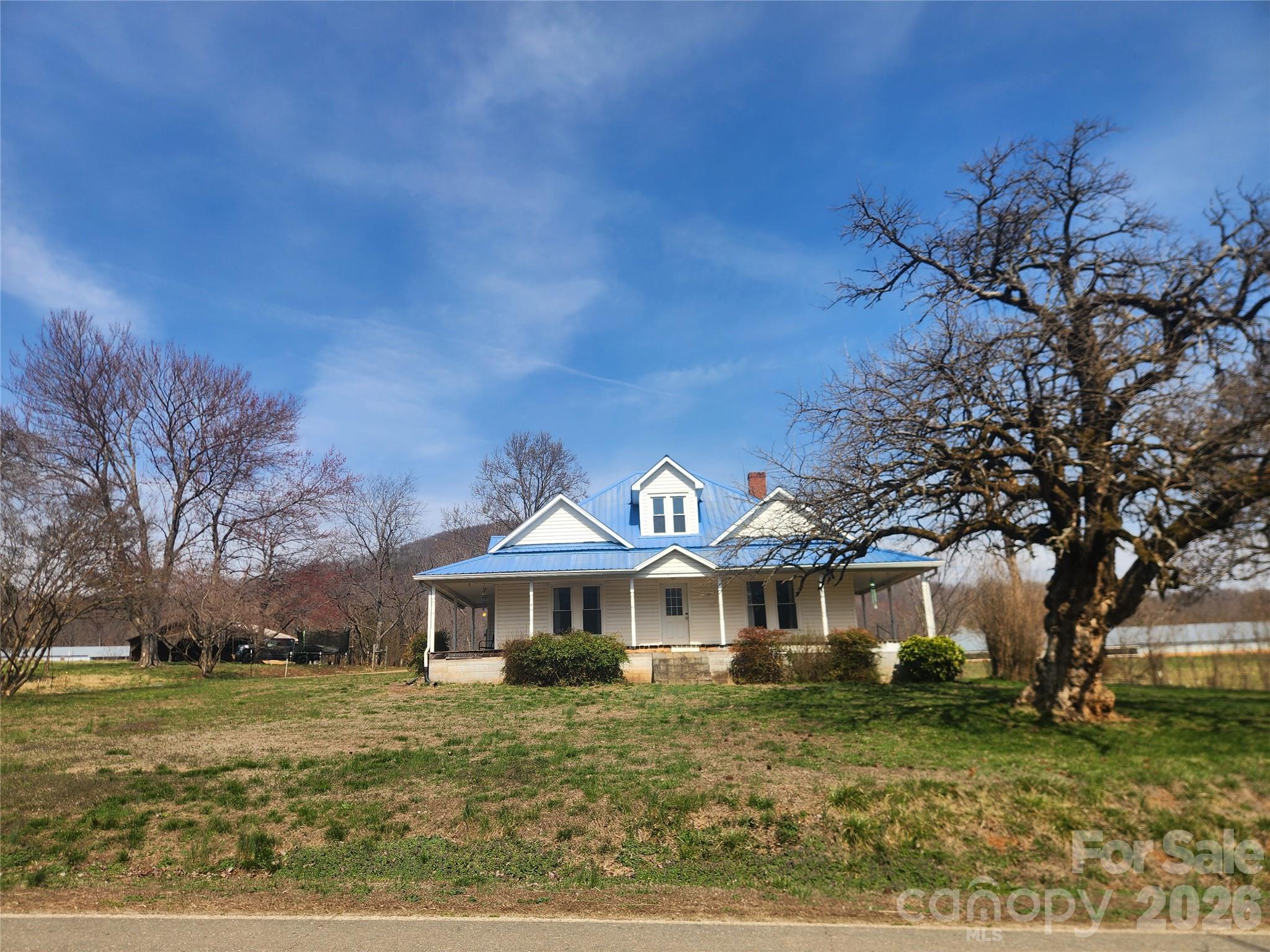 363 Center Church Road Hiddenite, NC 28636 - Photo 1 of 48 a front view of a house with a yard