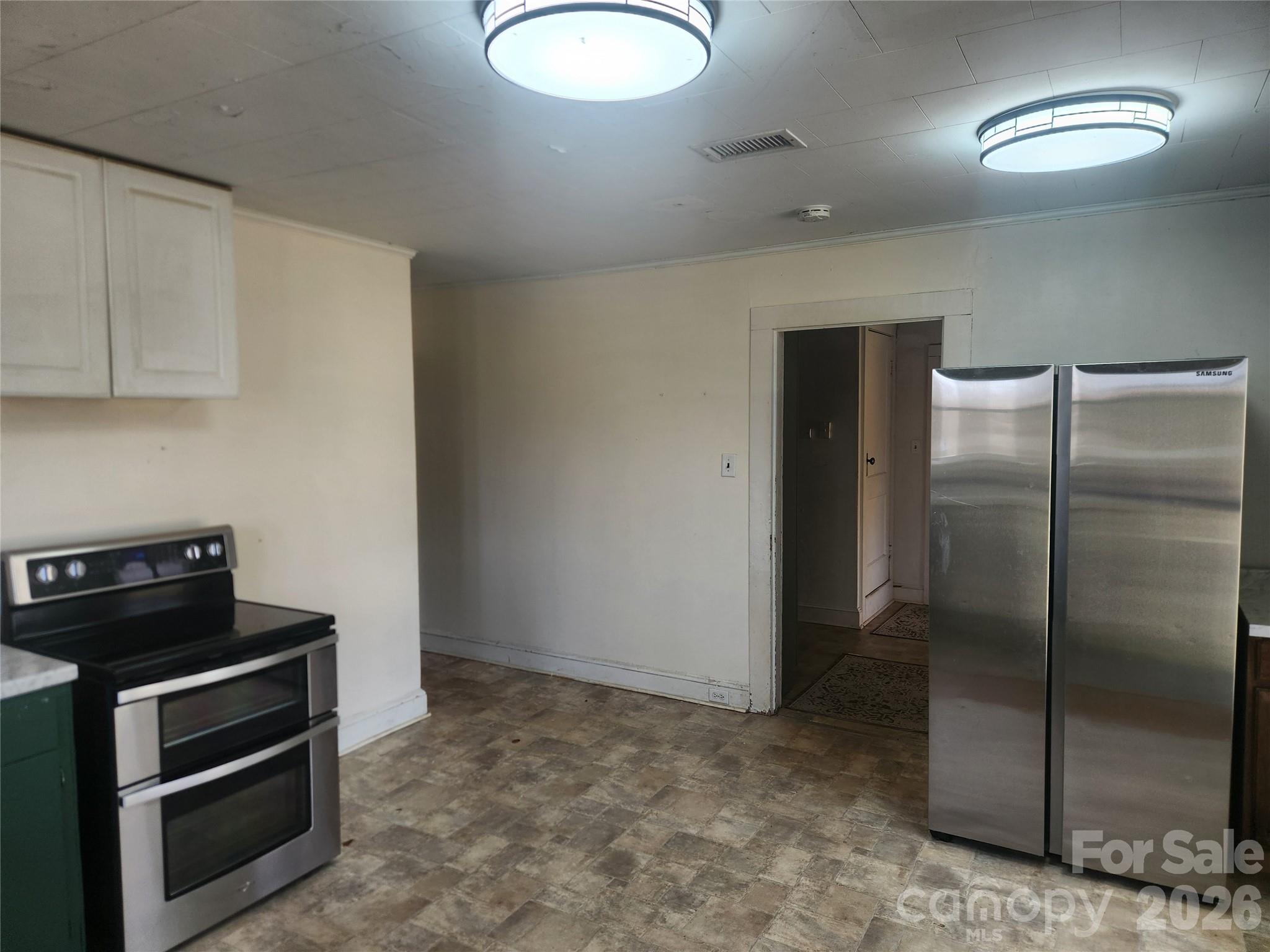 363 Center Church Road Hiddenite, NC 28636 - Photo 21 of 48 a kitchen with a refrigerator and stove