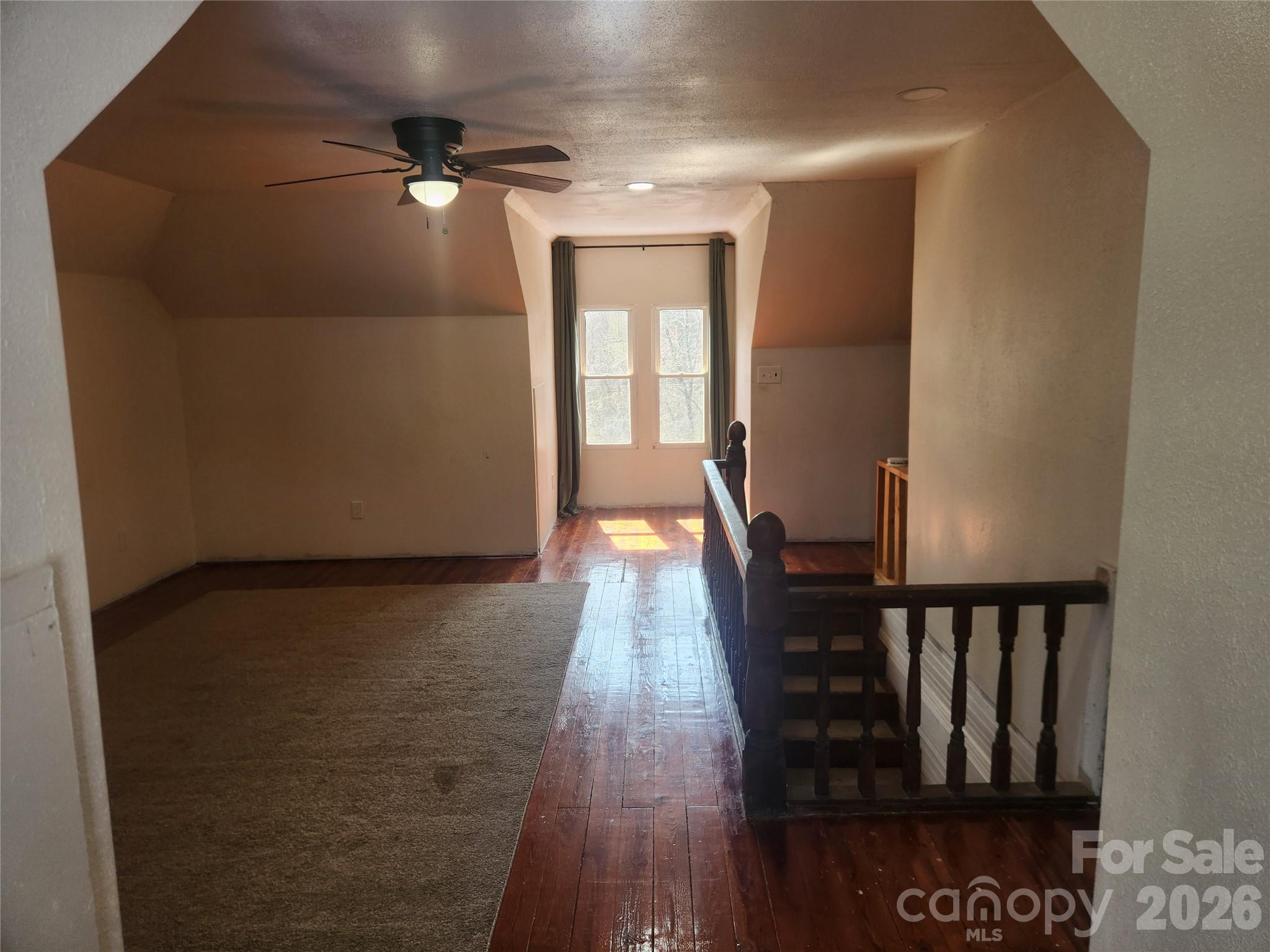 363 Center Church Road Hiddenite, NC 28636 - Photo 28 of 48 a view of a hallway with wooden floor and staircase