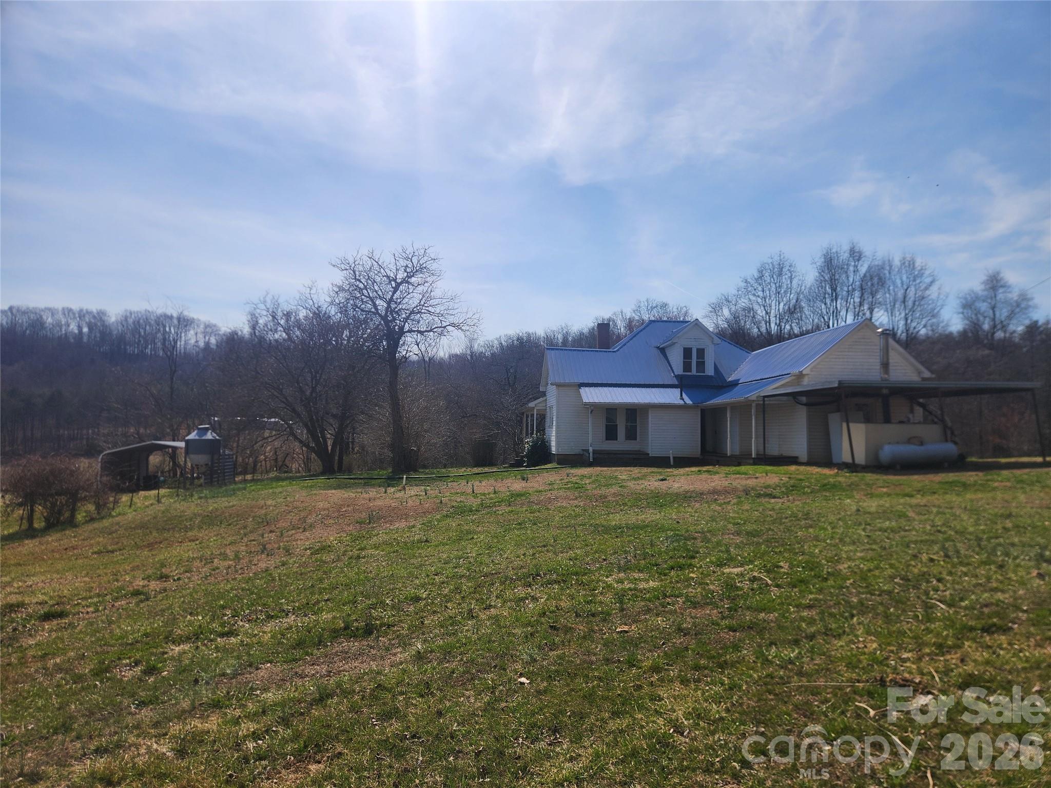 363 Center Church Road Hiddenite, NC 28636 - Photo 32 of 48 a house view with a garden space