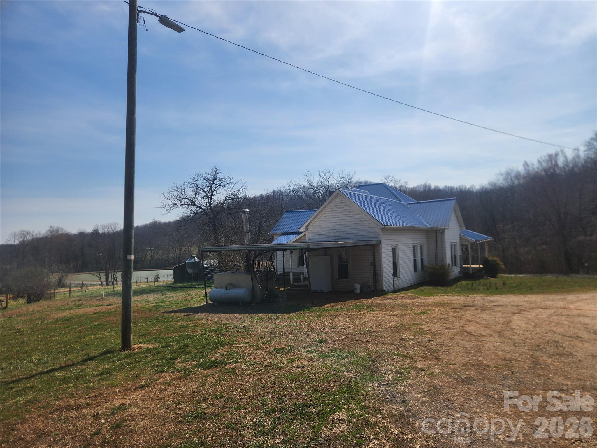 363 Center Church Road Hiddenite, NC 28636 - Photo 33 of 48 a view of a house with a yard