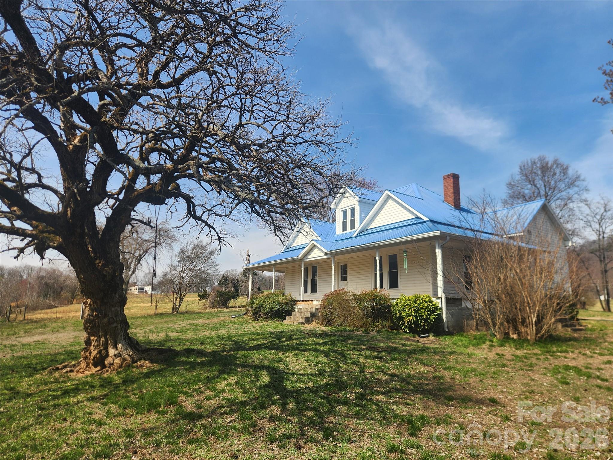 363 Center Church Road Hiddenite, NC 28636 - Photo 37 of 48 a front view of a house with a yard