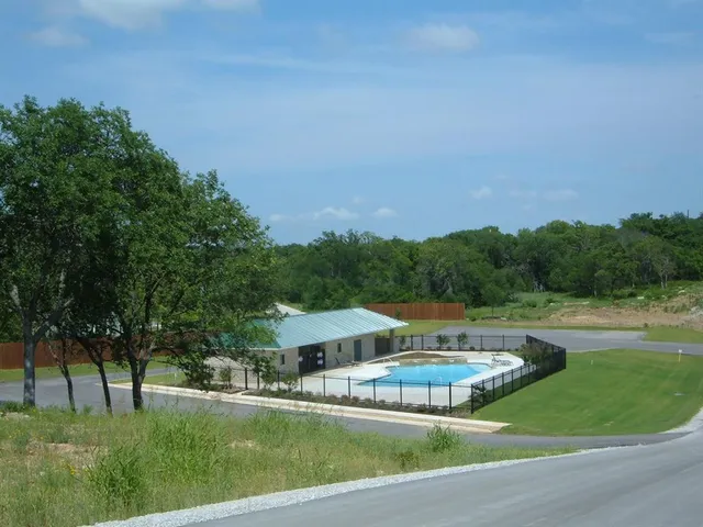 a view of a house with a big yard