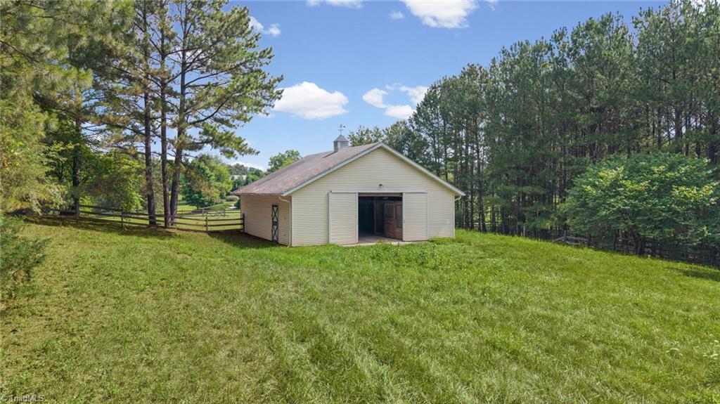 1044 Lasley Road Lewisville, NC 27023 - Photo 42 of 50 Three-stall barn ready for horses, hobbies, or additional storage