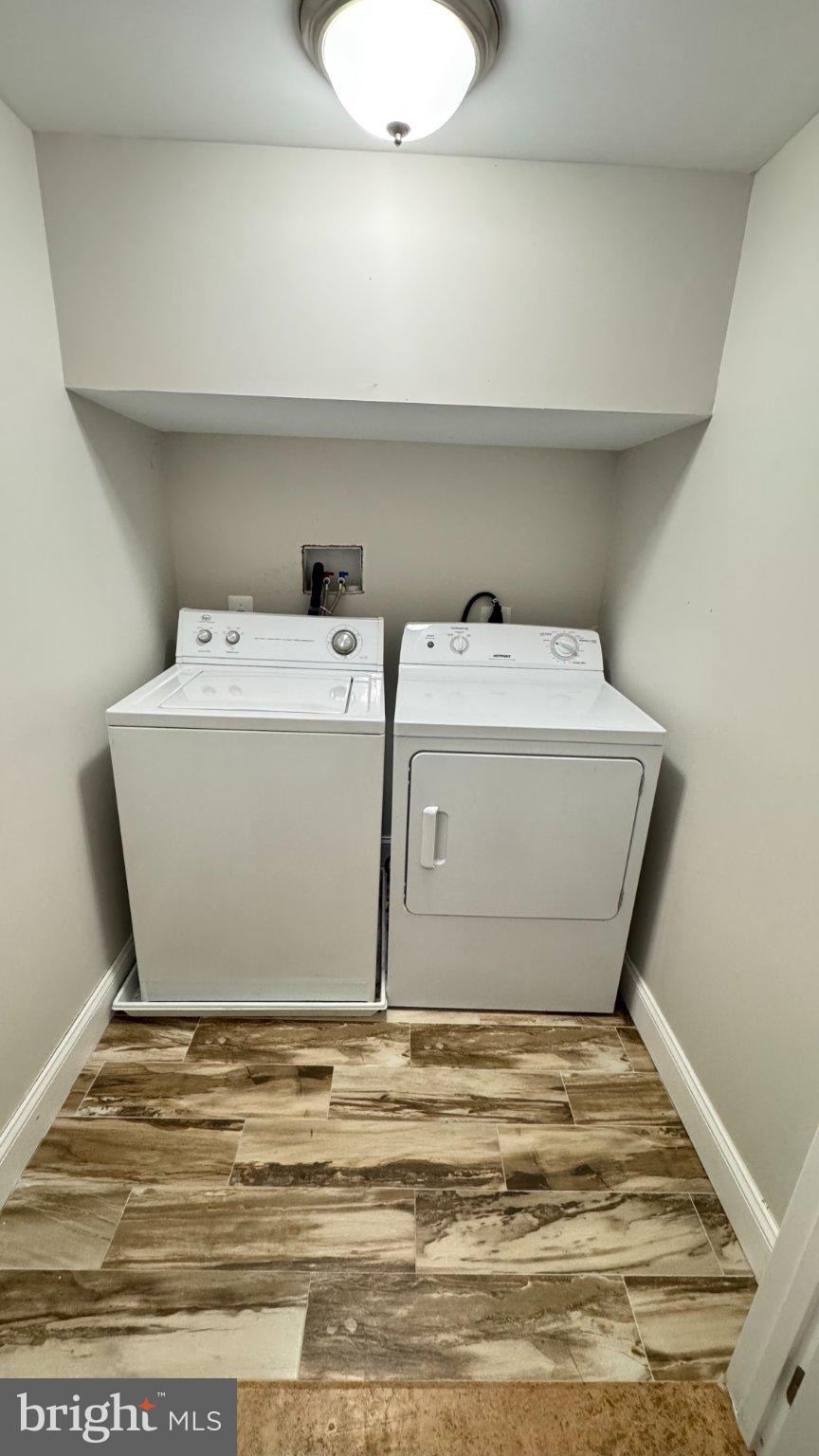 2705 East Biddle Street Baltimore, MD 21213 - Photo 12 of 12 a utility room with washer and dryer