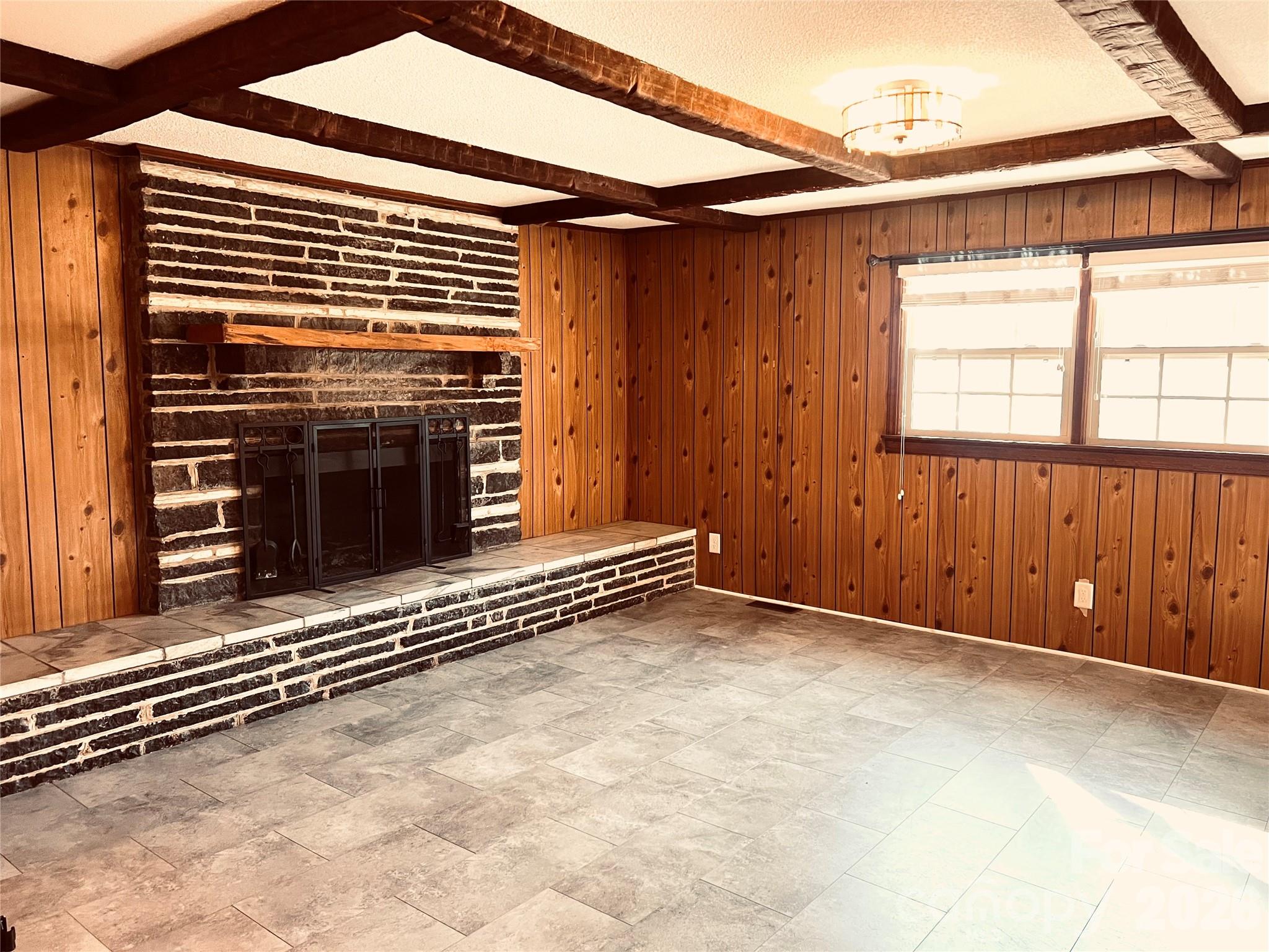 400 Stroupe Street Mount Holly, NC 28120 - Photo 13 of 26 a view of a room with wooden walls
