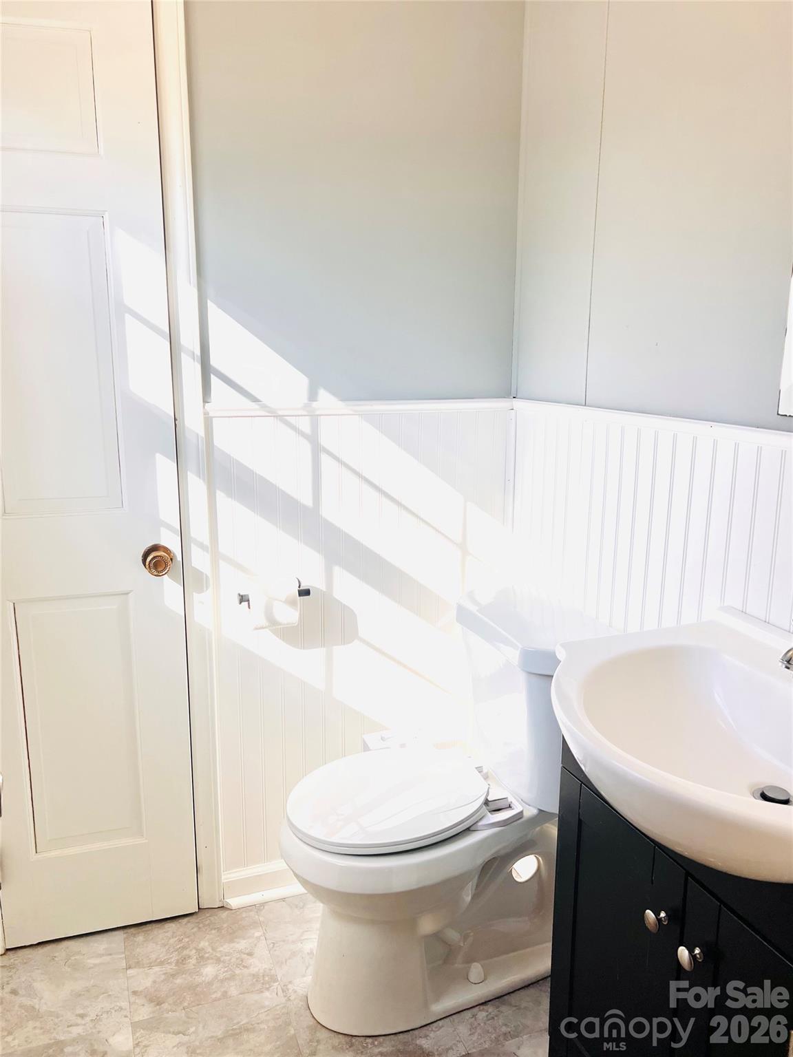 400 Stroupe Street Mount Holly, NC 28120 - Photo 14 of 26 a bathroom with a sink a toilet and shower