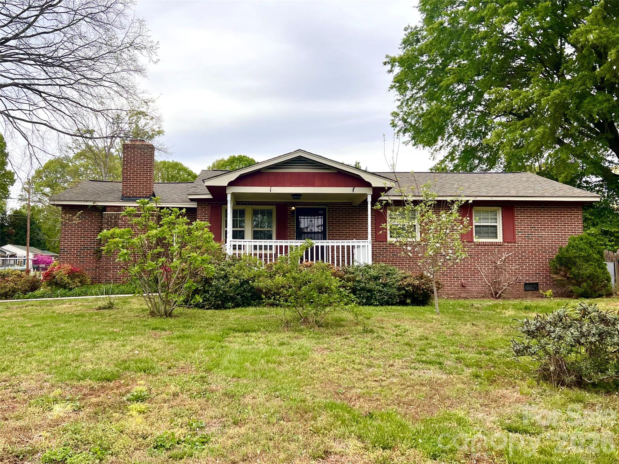 400 Stroupe Street Mount Holly, NC 28120 - Photo 2 of 26 a front view of a house with garden