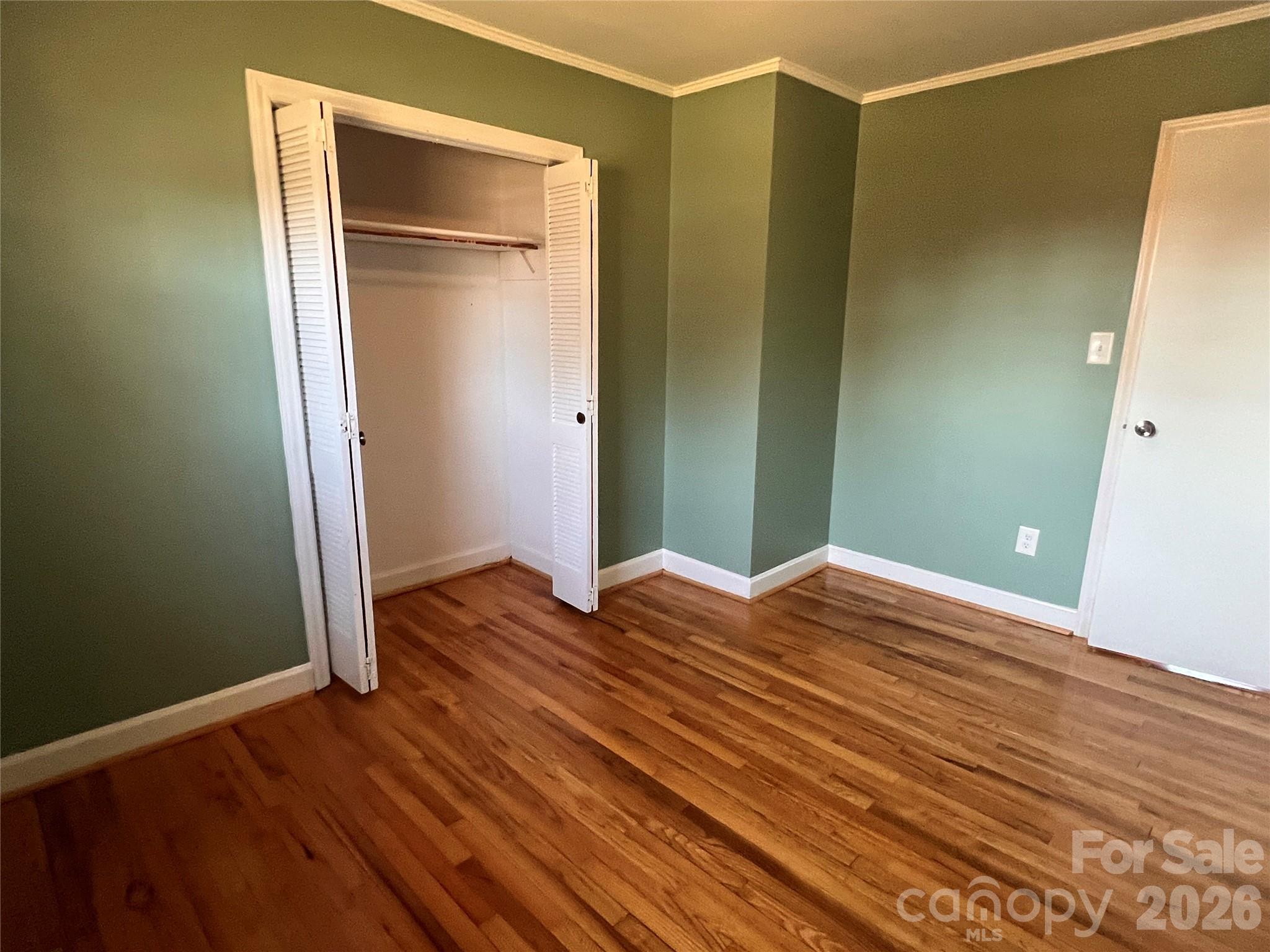 400 Stroupe Street Mount Holly, NC 28120 - Photo 21 of 26 a view of empty room with wooden floor