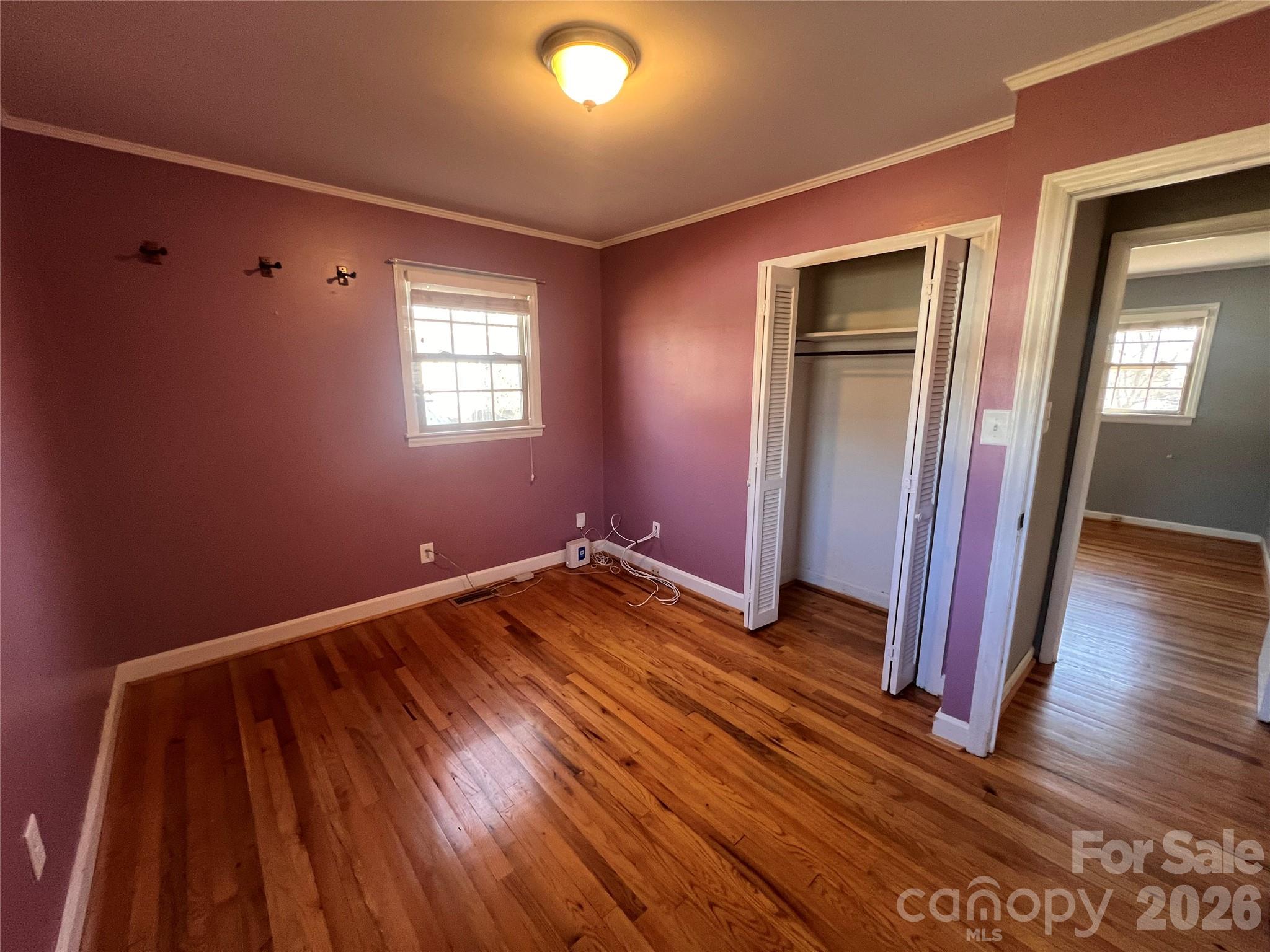 400 Stroupe Street Mount Holly, NC 28120 - Photo 23 of 26 a view of an empty room with wooden floor