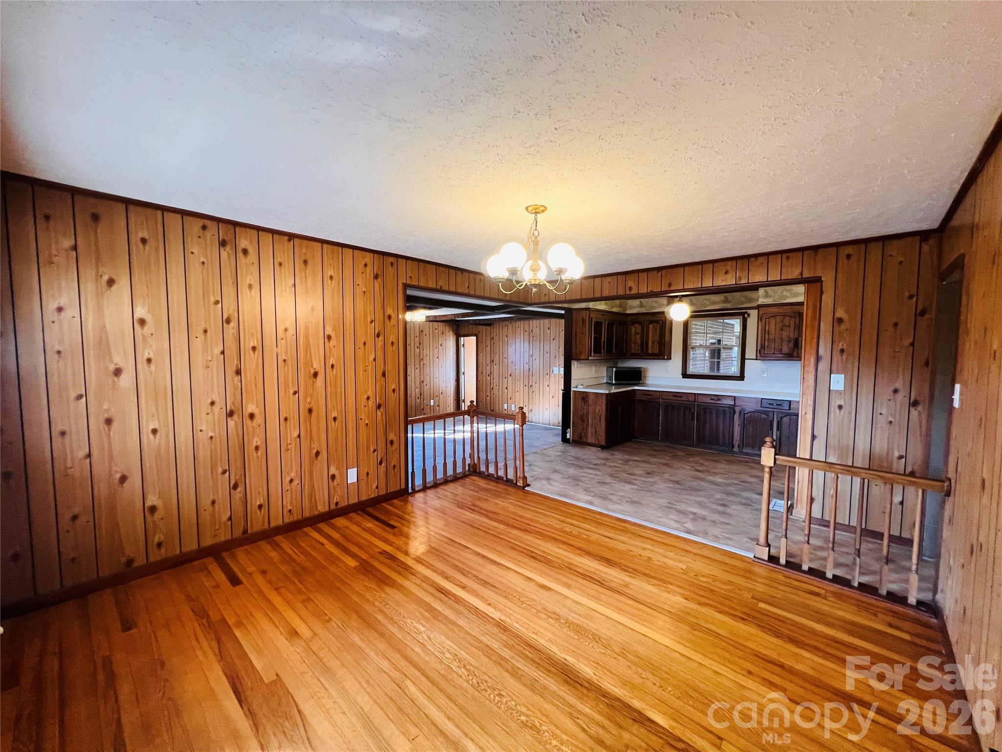 400 Stroupe Street Mount Holly, NC 28120 - Photo 4 of 26 a view of a room with wooden floor and stairs