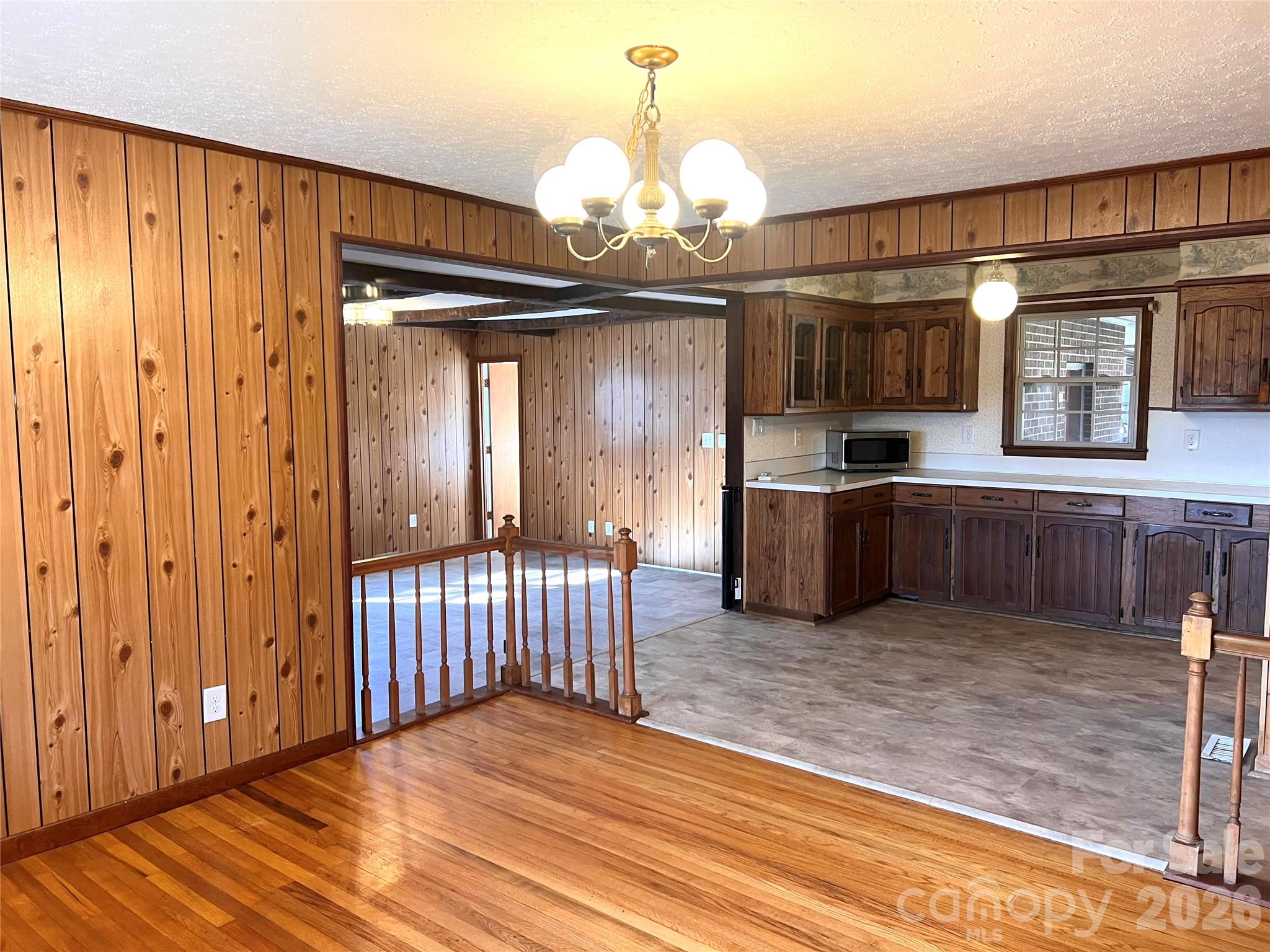 400 Stroupe Street Mount Holly, NC 28120 - Photo 5 of 26 a view of a livingroom with a furniture wooden floor and staircase