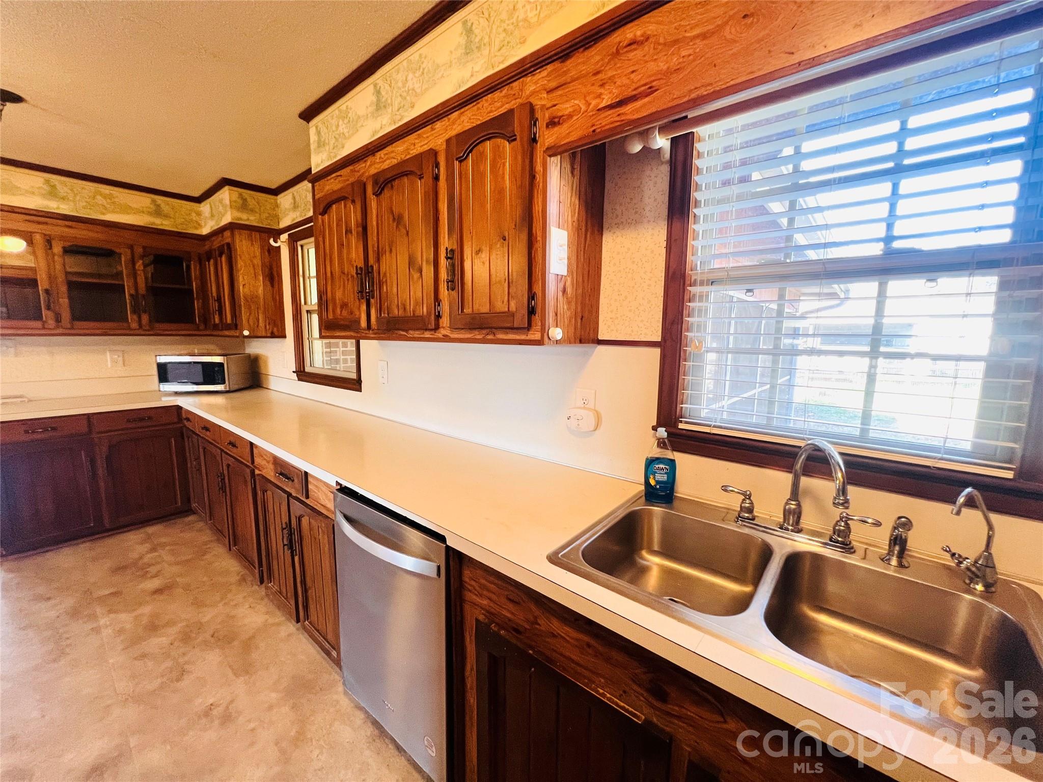400 Stroupe Street Mount Holly, NC 28120 - Photo 9 of 26 a kitchen with stainless steel appliances granite countertop a sink and a stove