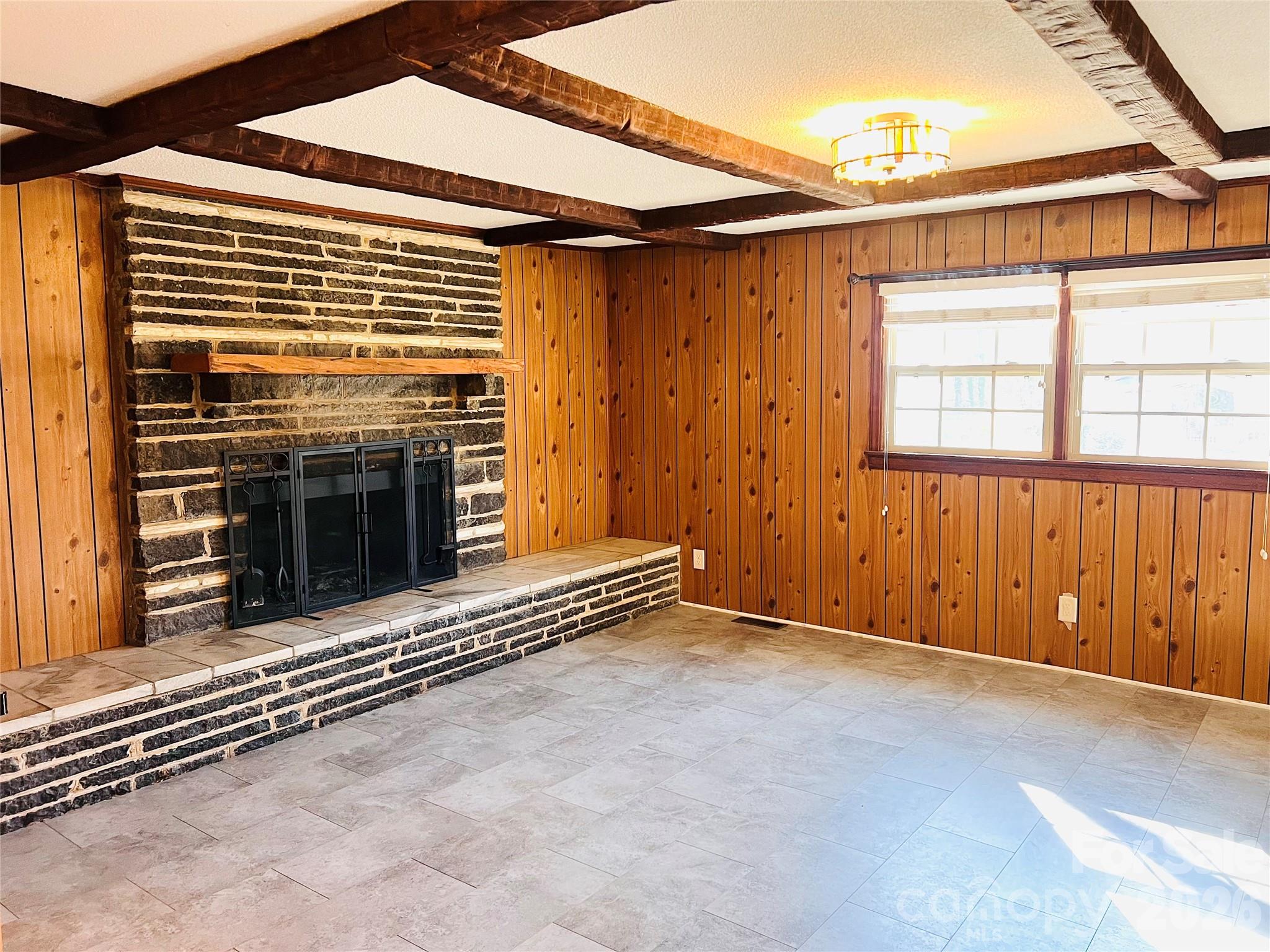400 Stroupe Street Mount Holly, NC 28120 - Photo 10 of 26 a view of an empty room with a fireplace