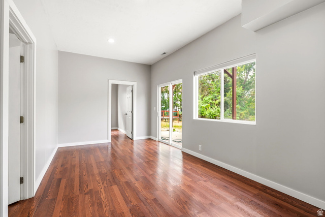 2154 Wasatch Boulevard Sandy, UT 84092 - Photo 30 of 32 Spacious room featuring wood-finish flooring, light gray wall paint, and white trim