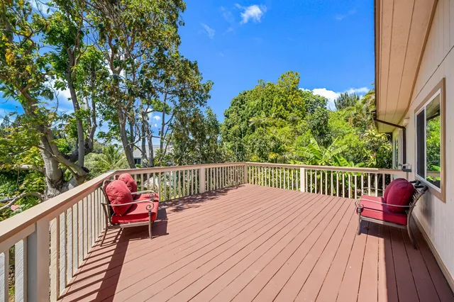 a view of balcony with furniture