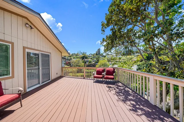a view of balcony with deck and wooden floor