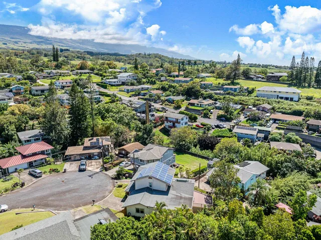a aerial view of a house with swimming pool and porch