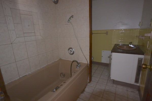 5 Spring Road Middleton, MA 01949 - Photo 15 of 16 a bathroom with a bathtub sink and toilet