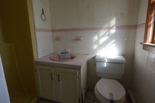 5 Spring Road Middleton, MA 01949 - Photo 16 of 16 a bathroom with a toilet a sink and mirror