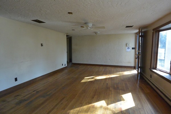 5 Spring Road Middleton, MA 01949 - Photo 3 of 16 a view of an empty room with a window