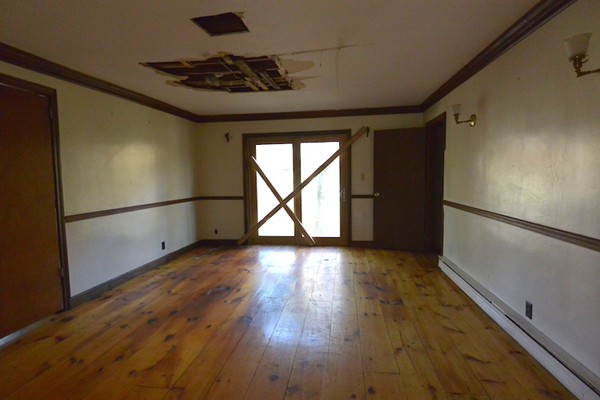 5 Spring Road Middleton, MA 01949 - Photo 5 of 16 a view of empty room with wooden floor and fan