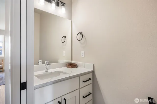 a bathroom with a sink and a mirror