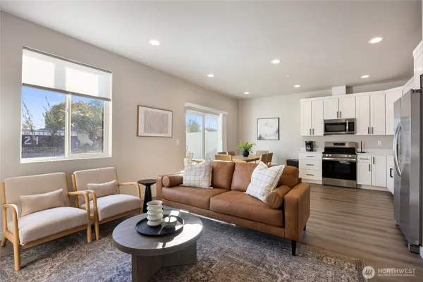 a living room with furniture and a large window