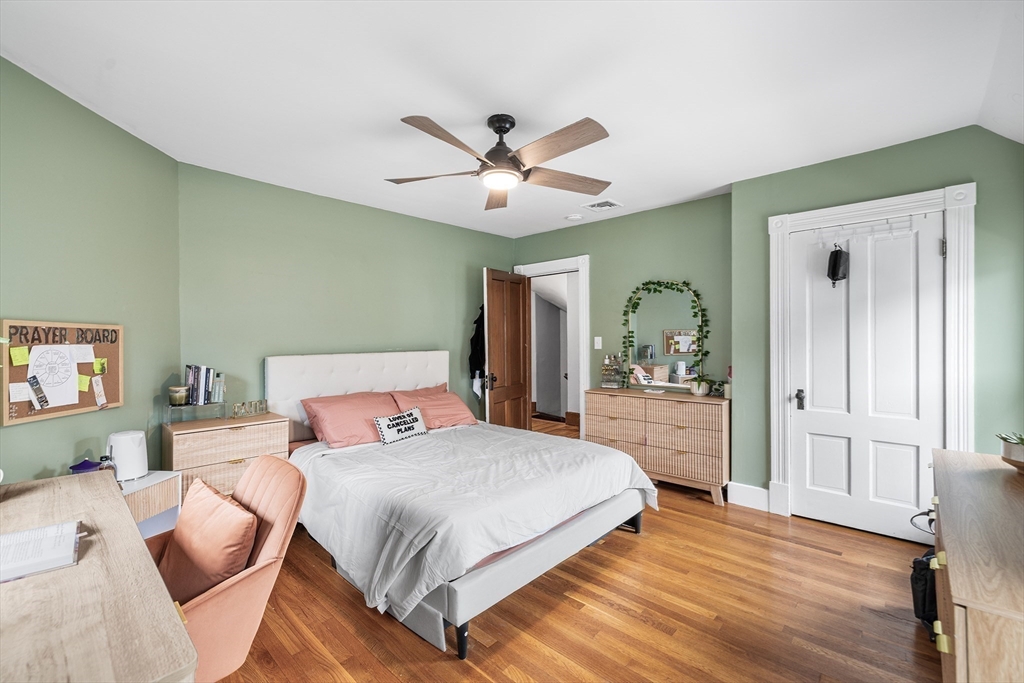 4 State Street, Unit 4 Milford, MA 01757 - Photo 13 of 23 a bedroom with a large bed and a chandelier