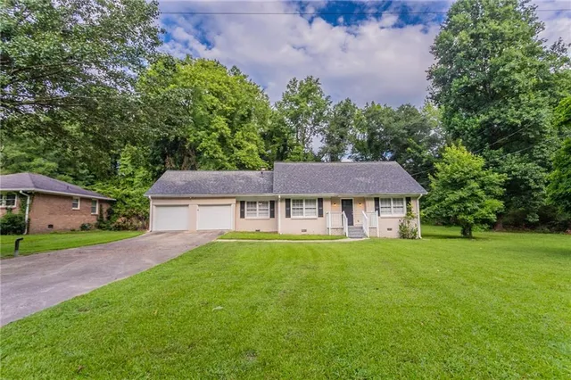front view of a house with a yard