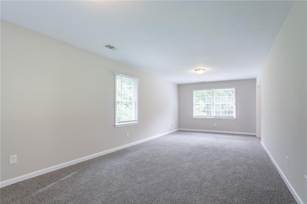 542 Hasty Drive Lithia Springs, GA 30122 - Photo 14 of 44 an empty room with a window