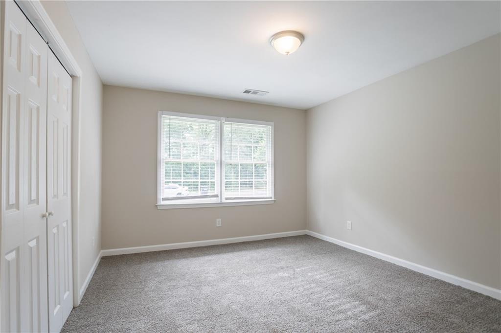542 Hasty Drive Lithia Springs, GA 30122 - Photo 17 of 44 an empty room with a window