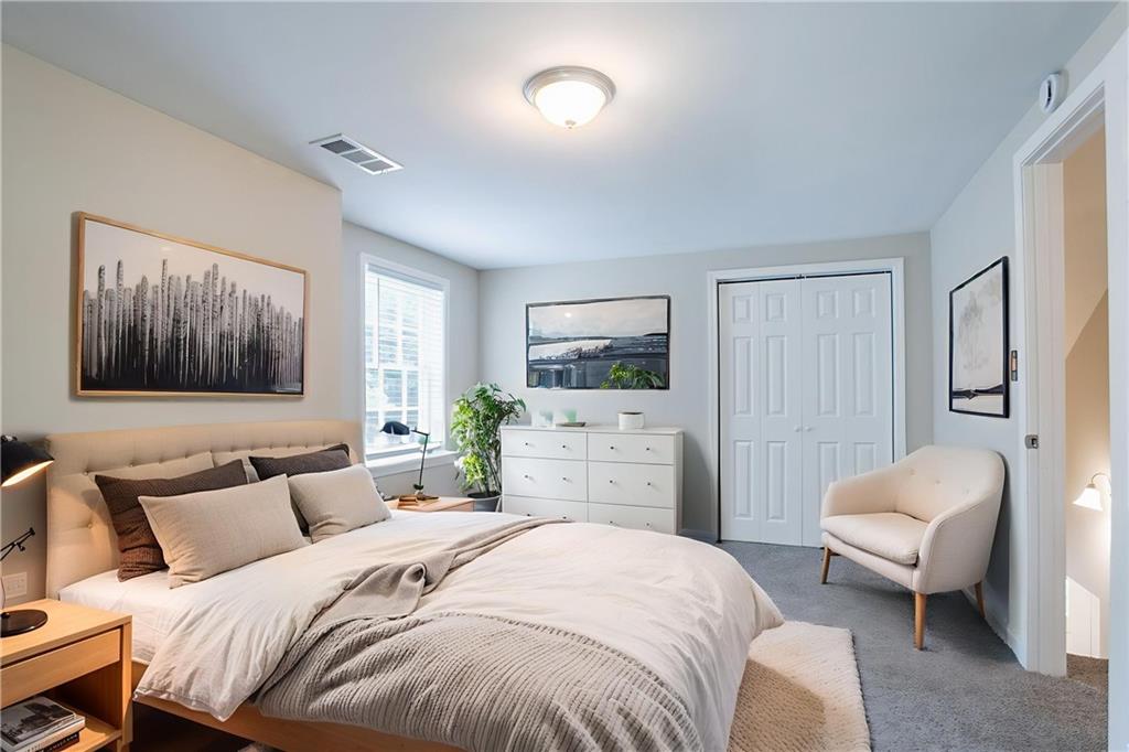 542 Hasty Drive Lithia Springs, GA 30122 - Photo 20 of 44 a bed room with a bed and a television