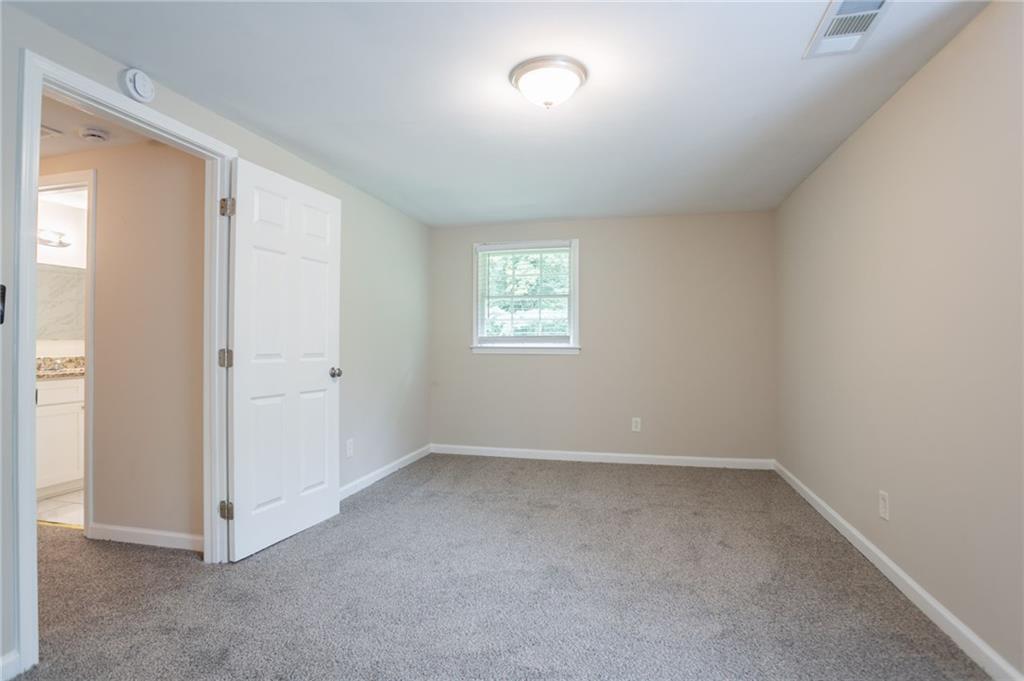 542 Hasty Drive Lithia Springs, GA 30122 - Photo 22 of 44 an empty room with windows