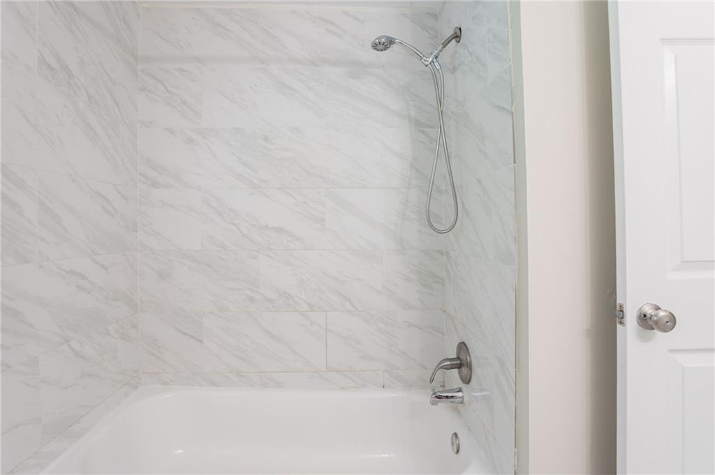 542 Hasty Drive Lithia Springs, GA 30122 - Photo 24 of 44 a bathroom with a shower