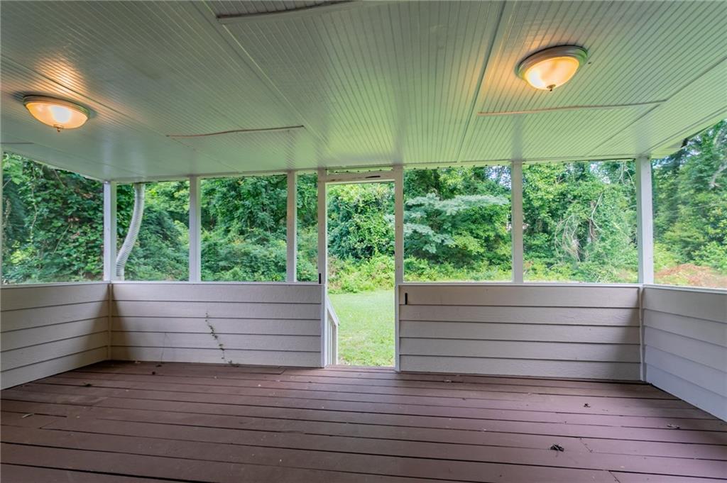 542 Hasty Drive Lithia Springs, GA 30122 - Photo 34 of 44 a view of a wooden deck with a yard
