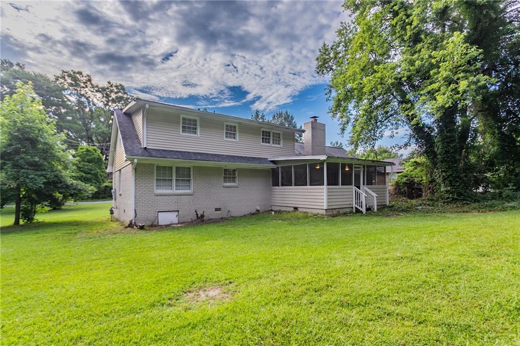 542 Hasty Drive Lithia Springs, GA 30122 - Photo 37 of 44 a view of a house with a yard