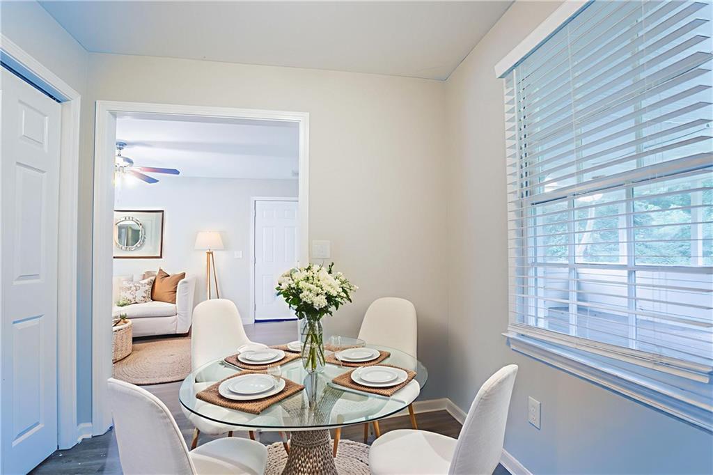 542 Hasty Drive Lithia Springs, GA 30122 - Photo 8 of 44 a view of a dining room with furniture window and wooden floor