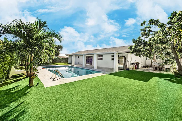 a view of a house with a big yard