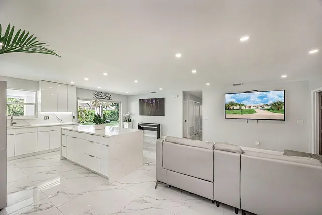 a view of a kitchen with microwave and cabinets