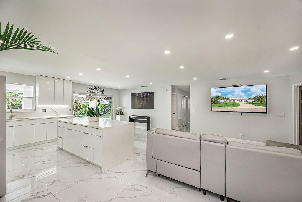 1881 Caribbean Road West Lake Clarke Shores, FL 33406 - Photo 15 of 40 a view of a kitchen with microwave and cabinets