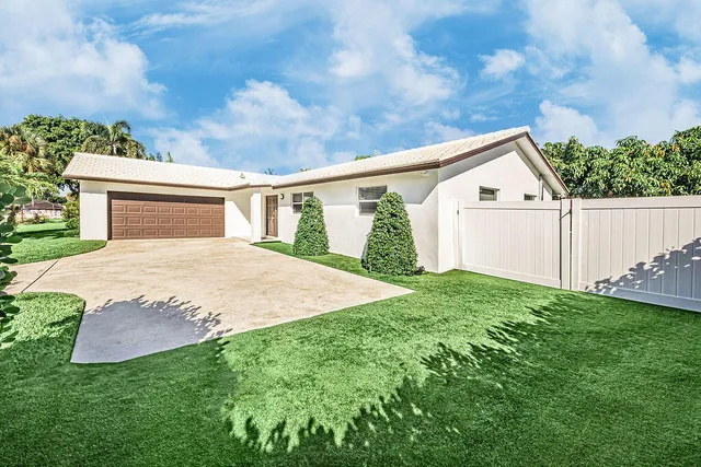 a view of backyard with large trees