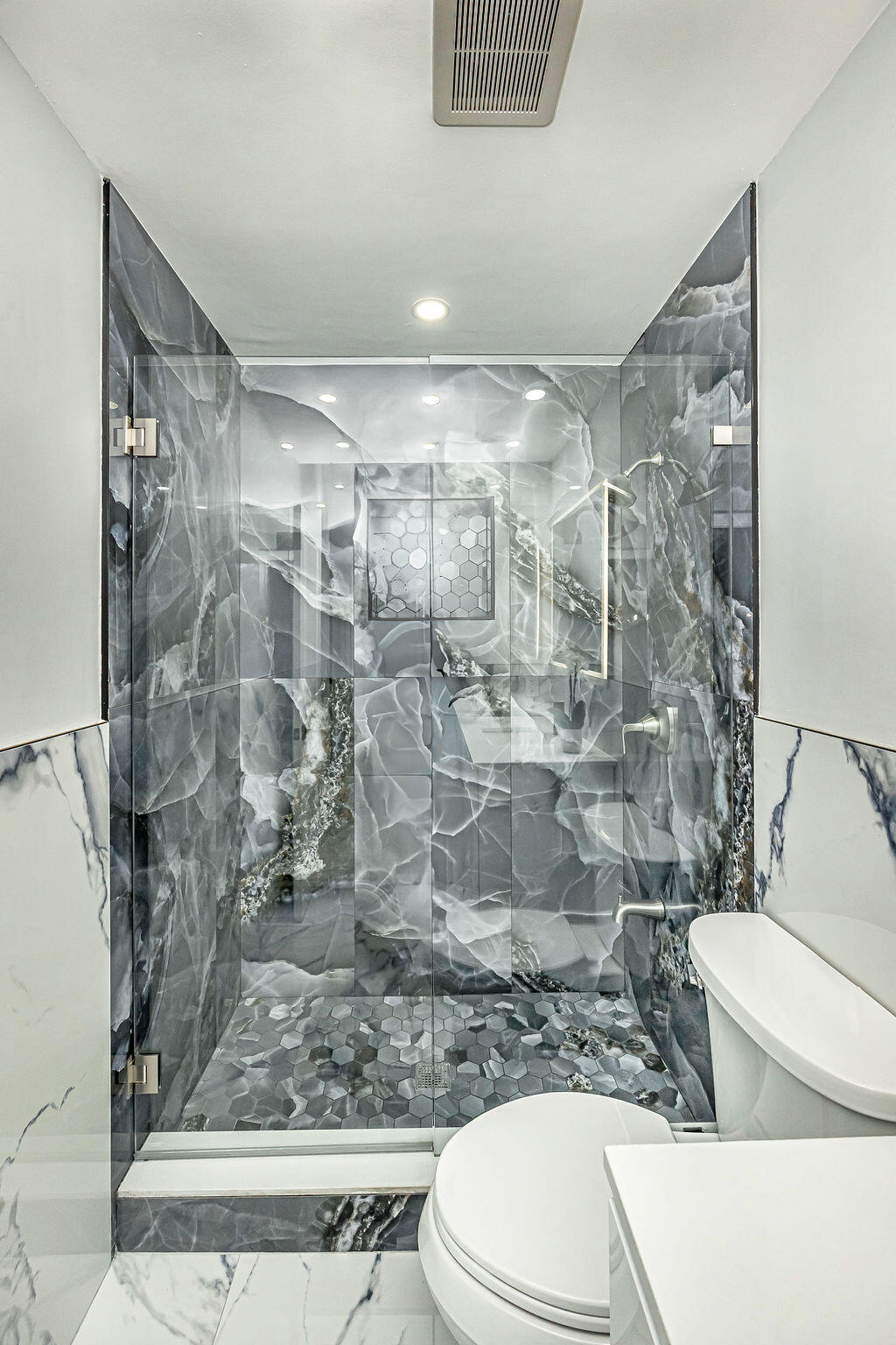 1881 Caribbean Road West Lake Clarke Shores, FL 33406 - Photo 31 of 40 a bathroom with a shower and a toilet