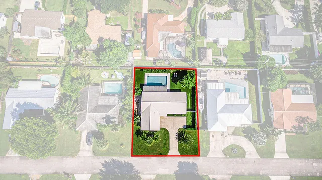 an aerial view of multiple houses with yard