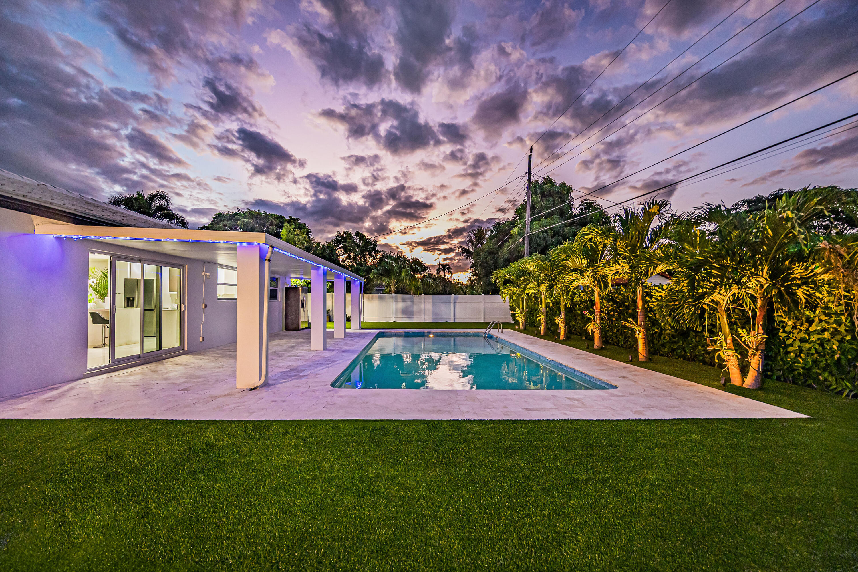 1881 Caribbean Road West Lake Clarke Shores, FL 33406 - Photo 39 of 40 a view of backyard with patio