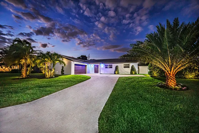 $985,000 | 1881 Caribbean Road West, Lake Clarke Shores, FL 33406