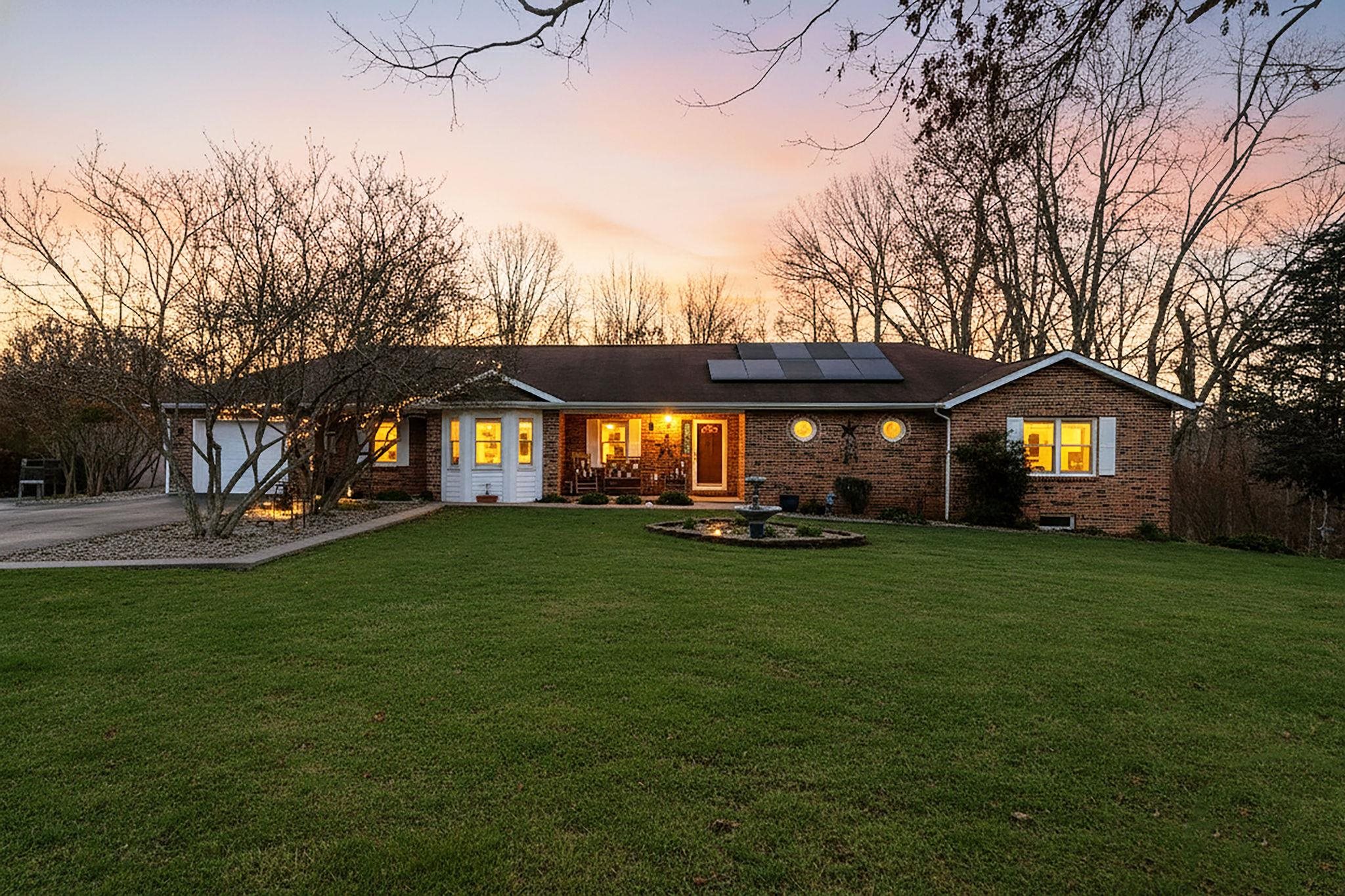 a view of a house and garden