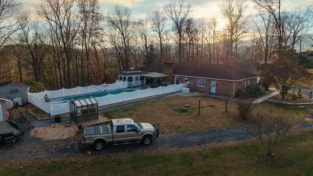 a backyard of a house with a yard and garage