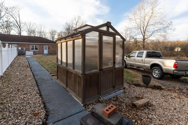 a kitchen with stainless steel appliances granite countertop a sink and a window