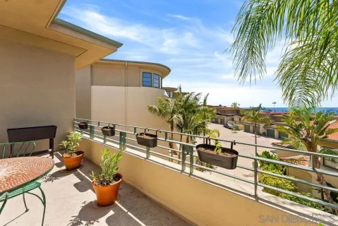 a view of a balcony with chairs
